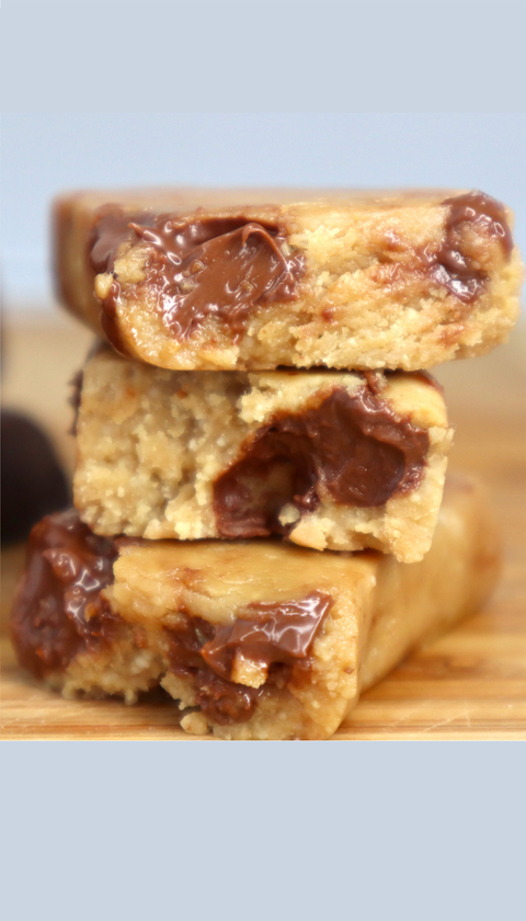 Raw Rev vegan protein bar cross-section showing real chocolate and nut texture